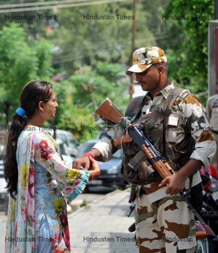 Women Tie Rakhi On The Wrist Of A Paramilitary Soldiers In Jammu