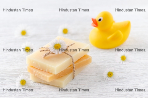 handmade natural baby soap with chamomile flowers and a duck toy