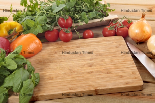 Herbs,And,Vegetables,With,A,Blank,Chopping,Board.,Space,For