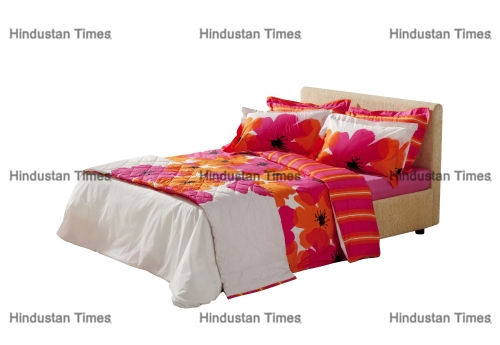 Colorful,Floral,Covers,On,Double,Bed,Isolated,On,White,Background