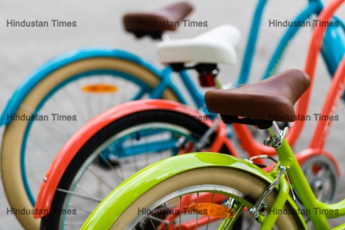 Row,Of,The,Bright,Colored,Classic,Women's,City,Bicycles,Parked