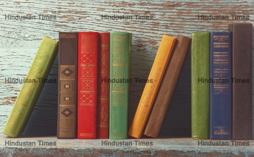 Old,Books,On,The,Background,Of,A,Wooden