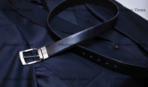 A,Black,Leather,Belt,With,Steel,Fittings,Lies,Horizontally,On