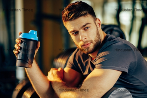 Handsome,Man,Resting,During,A,Workout,At,The,Gym