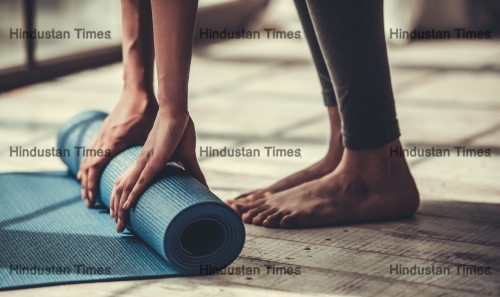 Cropped,Image,Of,Afro,American,Rolling,Yoga,Mat