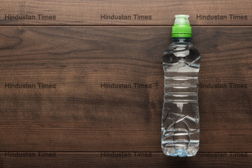 Plastic,Water,Bottle,On,The,Wooden,Table