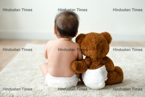 Back,Of,A,Baby,With,A,Teddy,Bear