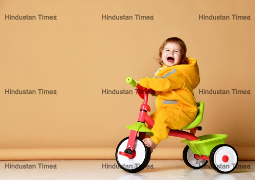 Baby,Girl,Kid,Riding,Her,First,Bicycle,Tricycle,In,Warm