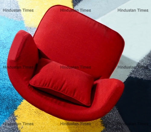 Top,View,Of,A,Red,Armchair,On,A,Colorful,Carpet