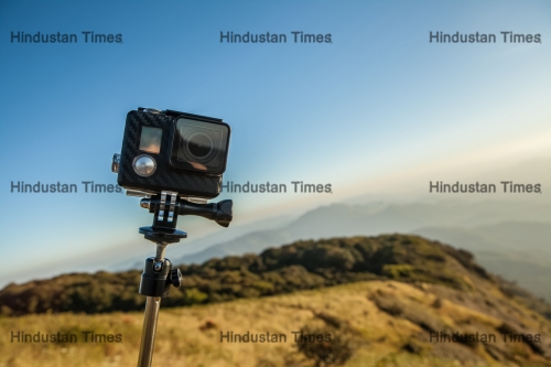 Action,Camera,With,Selfie,Pole,On,The,Peak,Of,Mountain