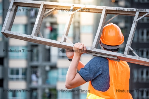 Young,Asian,Maintenance,Worker,Man,With,Orange,Safety,Helmet,And