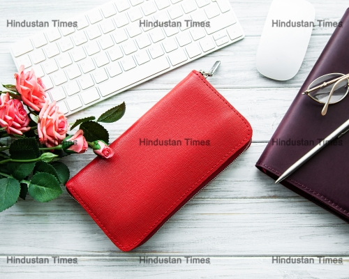Red,Leather,Women,Wallet,And,Office,Supplies,On,Wooden,Table