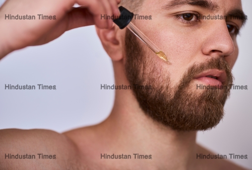 Close,Up,Image,Of,Handsome,Man,With,Pipette,With,Beard