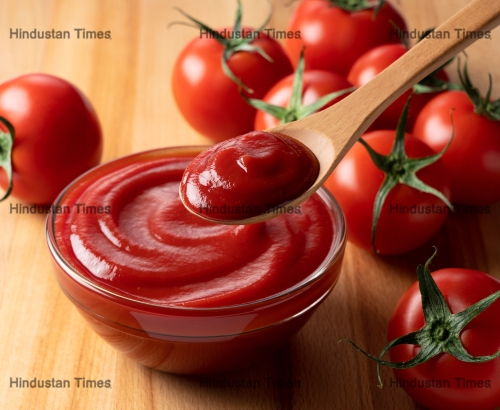 Close,Up,Of,Ketchup,And,Tomatoes,Placed,On,A,Wooden