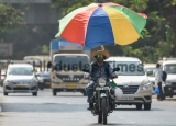 Umbrella Man On Bike