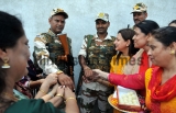 Women Tie Rakhi On The Wrist Of A Paramilitary Soldiers In Jammu