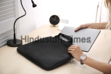 Woman,Putting,Laptop,Into,Case,At,Table,,Closeup