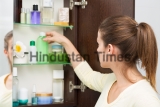 Beautiful,Girl,Choosing,Beauty,Products,From,The,Bathroom,Cabinet