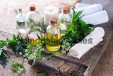 Organic,Essential,Aroma,Oil,With,Herbs,On,Aged,Wooden,Background.