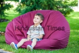 Excited,Kid,Having,Fun,On,Bean,Bag,At,Summer,Or