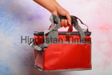 Hand,Holding,A,Red,Lunch,Pack,Carrier,Or,Insulation,Bag