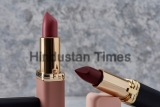 Red,Lipstick,With,Black,And,Pink,On,A,Marble,Surface