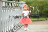 Beautiful,Little,Girl,In,Pink,Skirt,And,Bow,Standing,On