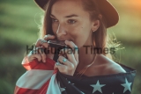 Portrait,Of,Boho,Chic,Woman,In,Hat,With,American,Flag