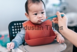 Little,Asian,Baby,Boy,With,Red,Bib,Waiting,For,Food