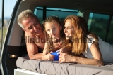 Happy,Family,Consisting,Of,Dad,Mom,And,Daughter,,In,Beachwear