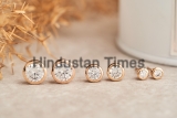 Close,Up,Golden,Stud,Earrings,,With,White,Crystals,And,Diamonds.