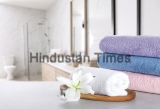 Fresh,Towels,And,Lily,Flower,On,Light,Grey,Marble,Table