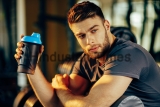 Handsome,Man,Resting,During,A,Workout,At,The,Gym