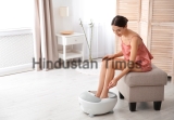 Woman,With,Beautiful,Legs,Using,Foot,Bath,At,Home,,Space