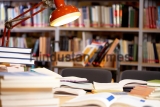 Image,Of,Place,In,Library:,Table,With,Lamp,And,Books