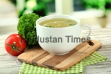 Cup,Of,Soup,On,Wooden,Table