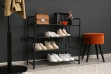 Shelving,Rack,With,Stylish,Shoes,And,Accessories,Near,Black,Wall