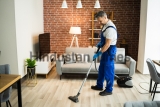 Man,In,Uniform,Vacuuming,House,Floor.,Cleaning,Home