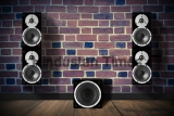 Black,Music,Speakers,On,Brick,Wall,And,A,Subwoofer