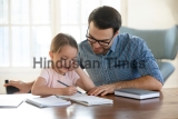Young,Father,In,Eyeglasses,Pleased,To,See,Little,Daughters',Study