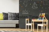 Sofa,Standing,Next,To,A,Chalkboard,Wall,With,Geometrical,Figures,