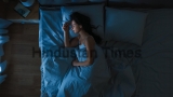 Top,View,Of,Beautiful,Young,Woman,Sleeping,Cozily,On,A