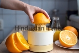 Female,Hand,Squeezing,Orange,Juice,From,Fresh,Oranges,With,A
