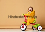 Baby,Girl,Kid,Riding,Her,First,Bicycle,Tricycle,In,Warm