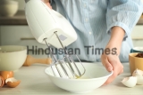 Woman,Is,Mixing,Eggs,In,A,Bowl