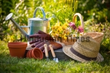 Gardening,Tools,And,A,Straw,Hat,On,The,Grass,In