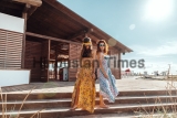 Two,Boho,Friends,(girls),Wearing,Floral,Maxi,Dress,And,Skirt