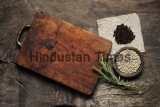 Cutting,Board,,Rosemary,And,Spices,On,A,Old,Wooden,Table