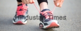 Female,Hands,Tying,Shoelace,On,Running,Shoes,Before,Practice.,Runner
