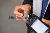 Hand,Of,Photographer,Holding,Sd,Memory,Card.,Male,Photographer,Changing